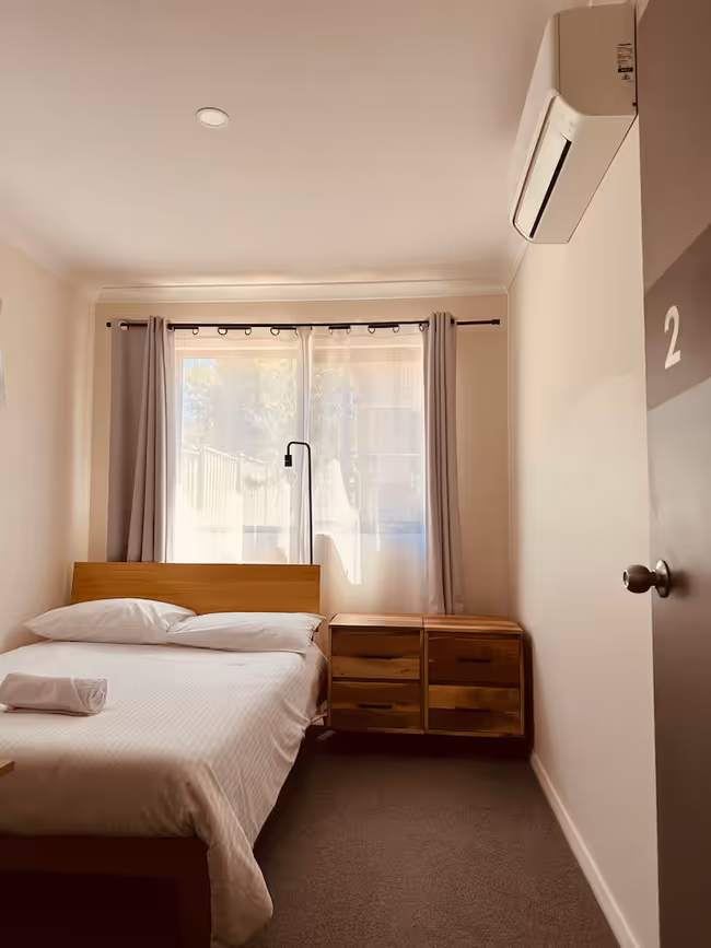 Room 2 - Double bed in a shared pool side guesthouse