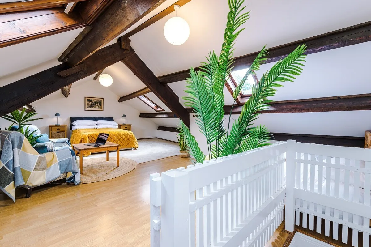 Attic bedroom from the top of the stairs