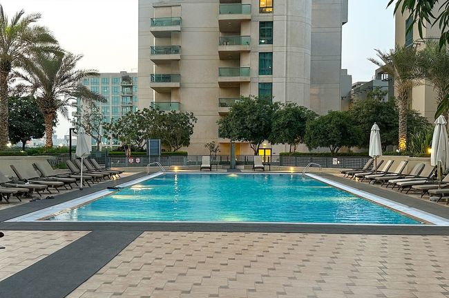 Stylish 1BR Retreat with Pool & Stunning City View