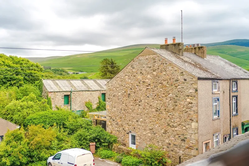 The back of the terrace with the fells behind