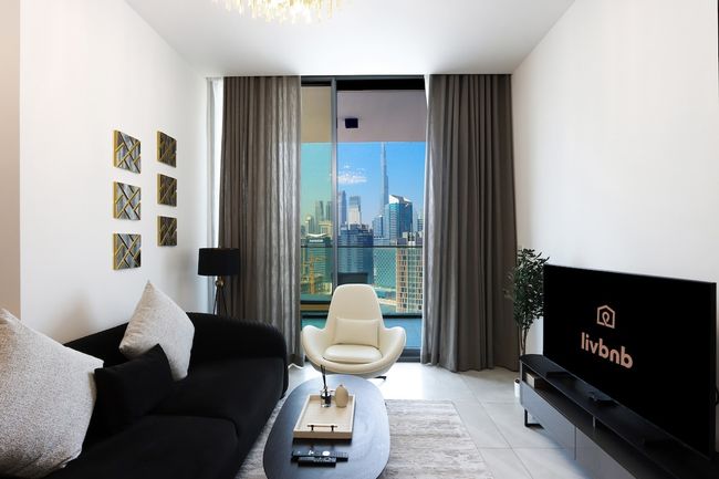 1BR Paragon Tower | Burj Khalifa & Canal Views