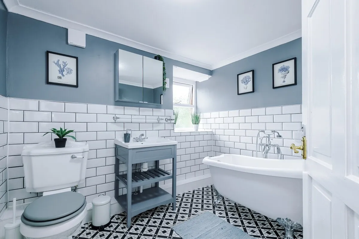 Bathroom with a freestanding bath and metro tiles