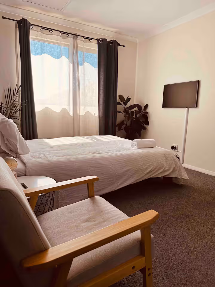 Room 1 - Queen bed in a shared pool side guesthouse