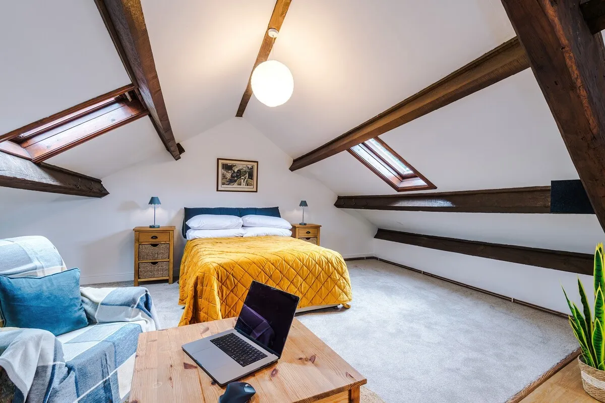 Laptop on the coffee table in the attic bedroom