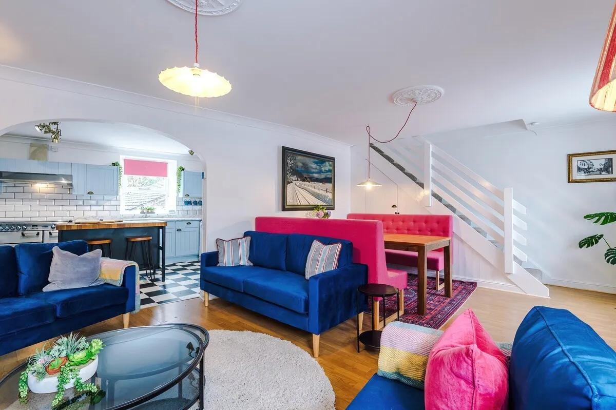 Open-plan living and dining space with the kitchen beyond