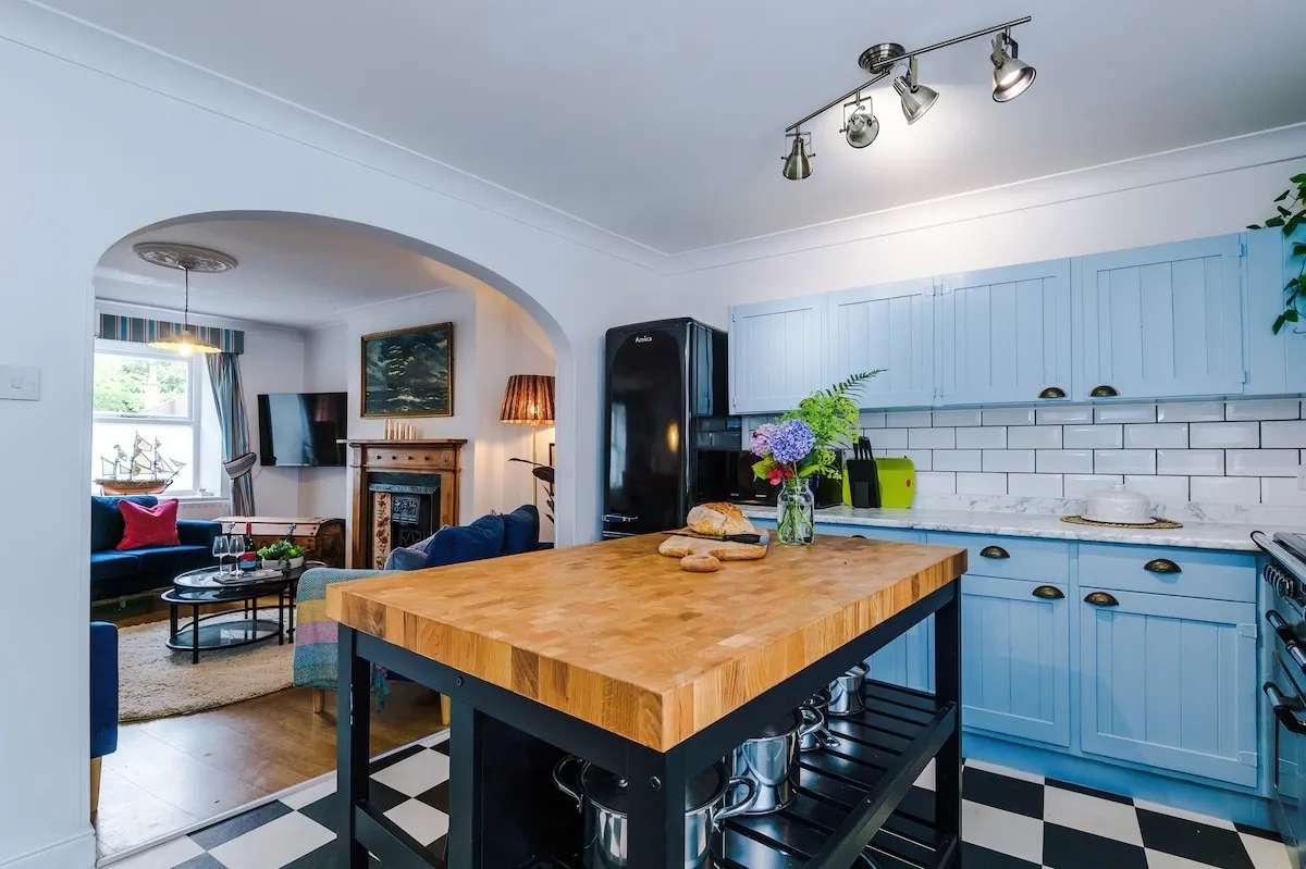 Kitchen island, looking through the arch to the lounge